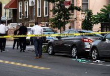 Outrage In NYC: Child Beaten, Motive Debated Police and crime scene tape on city street.