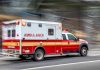Summer Fun, Deadly Silence Red and white ambulance driving on street.