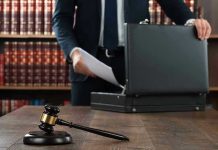 No-Bond Shock: Ex-NFL Star Booked Gavel, lawyer, briefcase, and legal books on the table.
