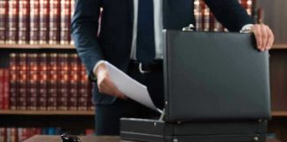 No-Bond Shock: Ex-NFL Star Booked Gavel, lawyer, briefcase, and legal books on the table.
