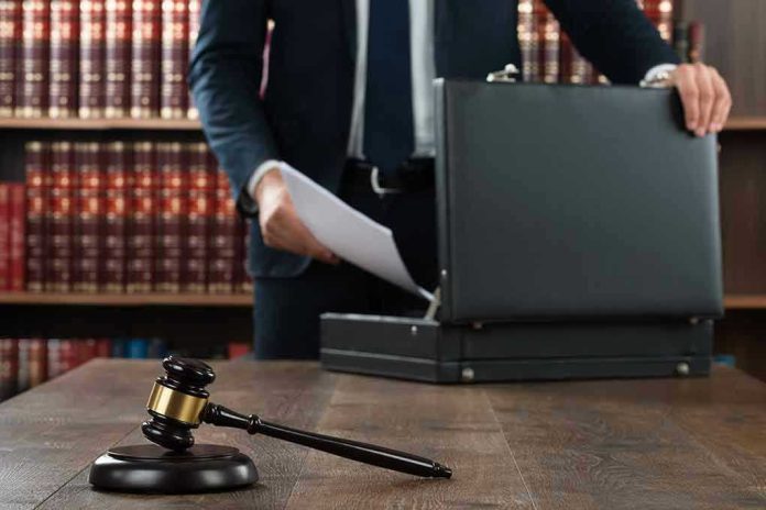 360047027 Gavel, lawyer, briefcase, and legal books on the table.