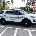 Coroner Conduct That Shocked the Court Sheriff SUV parked in a lot near palm trees