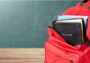Oregon Labels Parents ‘Child Abusers—For Words Red backpack with books on a classroom desk