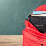 Oregon Labels Parents ‘Child Abusers—For Words Red backpack with books on a classroom desk