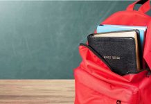 Oregon Labels Parents ‘Child Abusers—For Words Red backpack with books on a classroom desk
