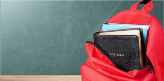Oregon Labels Parents ‘Child Abusers—For Words Red backpack with books on a classroom desk