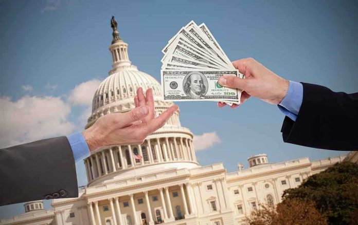shutterstock_192890837 Hands exchanging cash in front of the Capitol building