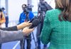 ESPN’s Double Standard Exposed Hands holding microphones in front of a person at a press conference
