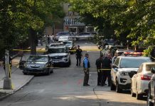 Broad-Daylight Stabbings Jolt Upper West Side Police officers secure a residential street with patrol cars and yellow tape