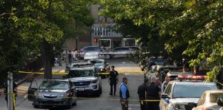 Broad-Daylight Stabbings Jolt Upper West Side Police officers secure a residential street with patrol cars and yellow tape
