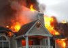 Eight Dead, Gunshots — What Happened Inside? House engulfed in flames with heavy smoke from the roof