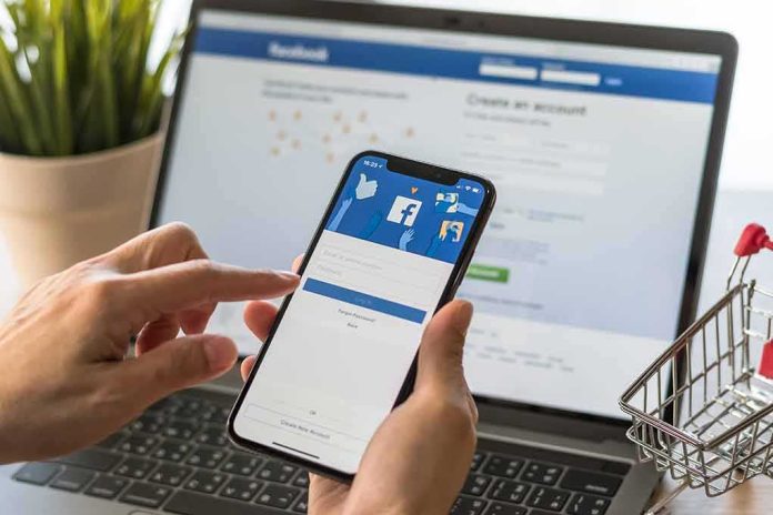 shutterstock_1048440403 Hands using a smartphone with a social media login screen