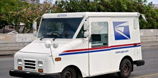 92 Animals Seized — Mail Route Mystery White USPS delivery truck parked on a street