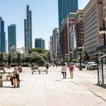 $150M To ANYONE Who Can Save San Francisco! City street with pedestrians and tall modern skyscrapers