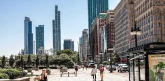 $150M To ANYONE Who Can Save San Francisco! City street with pedestrians and tall modern skyscrapers