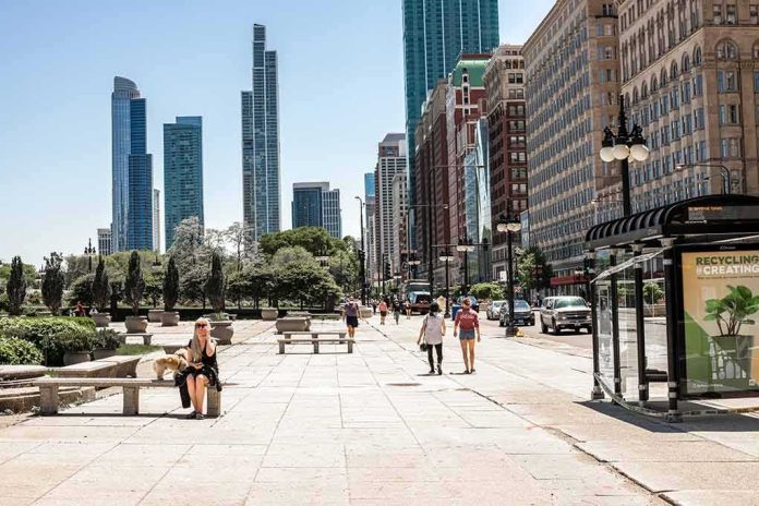 shutterstock_1752802139 City street with pedestrians and tall modern skyscrapers