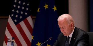 How the Autopen Became a Proxy for Presidential Power elderly man at conference table with flags in background