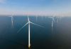 Offshore wind turbines in rows over calm sea