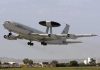 NATO AWACS aircraft taking off from an airfield