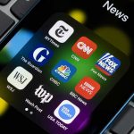 Trump DOJ Dragged Reporters Into Grand Jury News app icons on a smartphone screen.