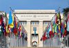 Argentina’s President Says the UN Has One Huge Problem United Nations building with numerous national flags outside.