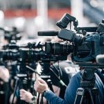 See What HATEFUL Radicals Did to Charlie Kirk’s Statue Broadcast cameras on tripods at a press event