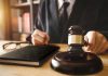 DOJ Files Misconduct Case Against Federal Judges Judge with gavel striking sound block