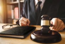 DOJ Files Misconduct Case Against Federal Judges Judge with gavel striking sound block