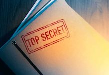 Abdul El-Sayed Becomes Eligible for Access to Classified Information Manila folder stamped top secret on a desk