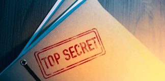 Abdul El-Sayed Becomes Eligible for Access to Classified Information Manila folder stamped top secret on a desk
