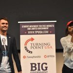 A Look Back ONE YEAR After Charlie Kirk’s Murder Curro Savoy at a TPUSA event with another speaker on stage