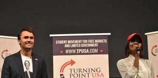 A Look Back ONE YEAR After Charlie Kirk’s Murder Curro Savoy at a TPUSA event with another speaker on stage