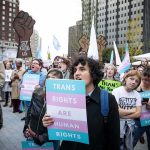 Talarico’s ‘God Is Non-Binary’ Regret Crowd of protesters holding trans rights signs at a city rally