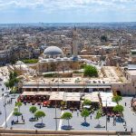 Sharia Showdown Hits Western Liberty historic mosque with domes and minaret overlooking a busy city square