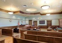Foster Mom Accused of Trading Teen for MONKEY Avoids Prison Empty courtroom with wooden benches and judge's bench