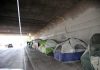 Stolen Voter IDs Fuel Skid Row Scam Tents lined up under a concrete overpass