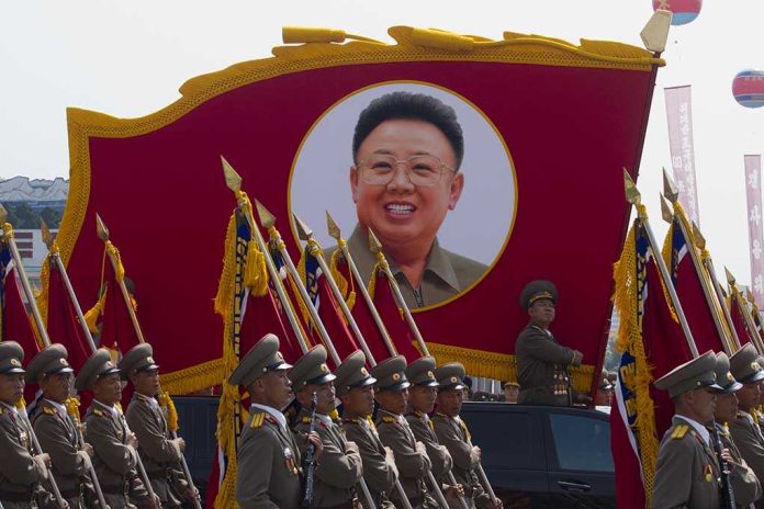 shutterstock_148621247 Kim Jong-il portrait banner above marching soldiers; Zhang Yufeng, Kosuke Fukudome, Hou Fenglian, Liu Guangbiao, Tsuyoshi Shinjo, Sadaharu Oh, and Lee Sang-hoon not visible