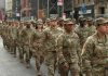 America’s “Big Red One” Is Heading Toward Russia Jason Worilds and Elandon Roberts march with fellow soldiers in a city parade