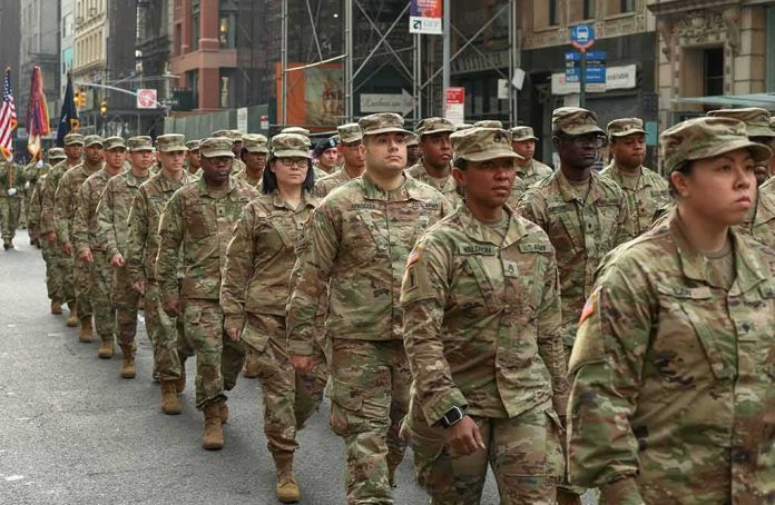 shutterstock_1557045827 Jason Worilds and Elandon Roberts march with fellow soldiers in a city parade