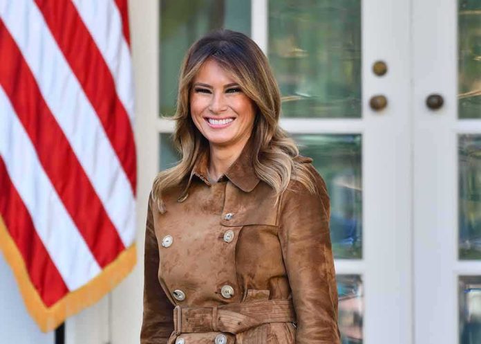 shutterstock_1572584635 woman smiling in a brown suede coat