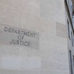 DOJ Pulls Death Penalty Department of Justice building exterior with American flags