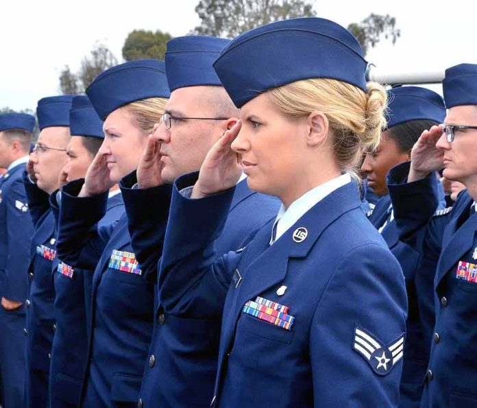 shutterstock_1611780100 Uniformed service members saluting in formation