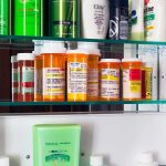 DOJ Power Play Targets Mailed Abortion Pills Medicine cabinet with prescription bottles and toiletries