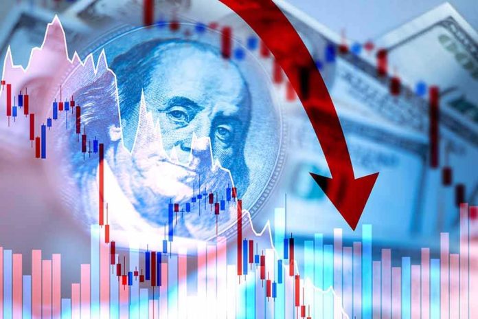 shutterstock_1695807724 US dollar and stock chart with red downward arrow