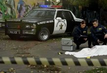 2 Ole Miss Students Found DEAD in Separate Incidents Crime scene with police car and two investigators by a covered body