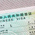 Feds Bust Massive 1,000-Marriage Immigration Fraud Ring Chinese visa document close-up