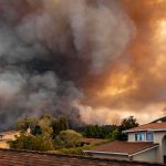Tariff Smoke Bomb Backfires Wildfire smoke billows over suburban houses