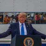 Trump’s Hard Line Rattles Iran Donald Trump speaks at a podium with arms outstretched