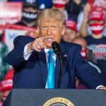 Trump 2028 Hat Lights Up Washington speaker pointing during a rally