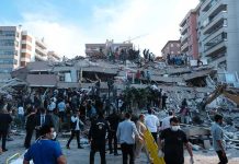 BBC, Reuters Flag U.S.-Made Killer Rescue workers and civilians on collapsed building after earthquake